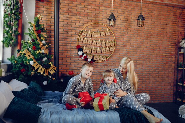 Family sitting on a bed