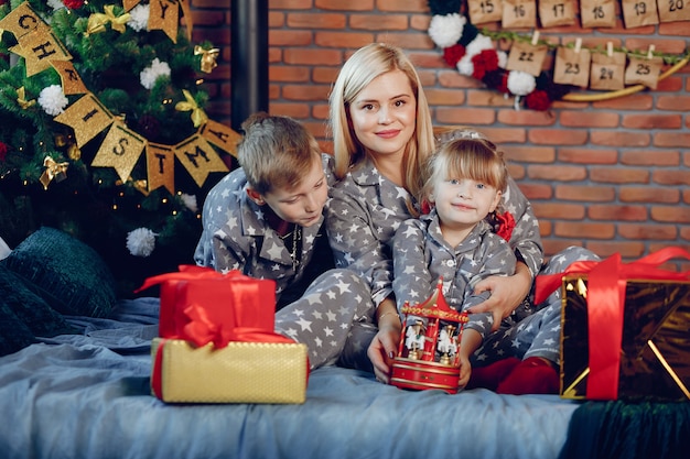 Family sitting on a bed