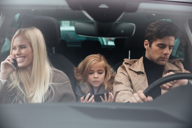 Family sitting in car