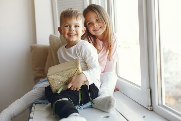 Family sitting at home with presents