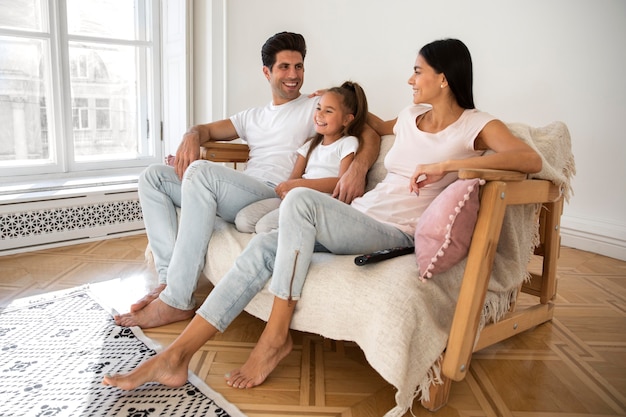 Family spending time in front of tv