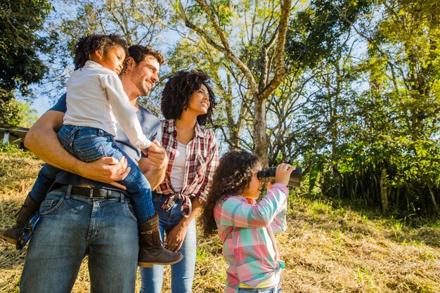 Family standing on a hill