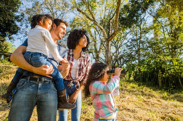 Family standing on a hill