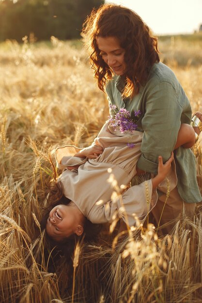 Family in a summer field. Sensual photo. Cute little girl.