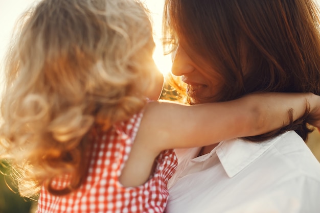 Free photo family in a summer field. sensual photo. cute little girl.