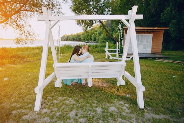 Free photo family on a swing