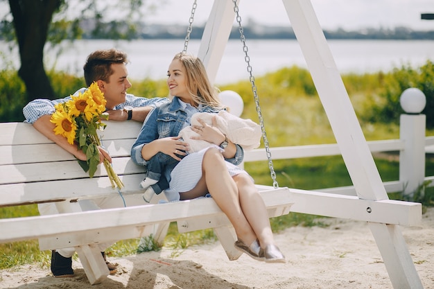 Free photo family on a swing