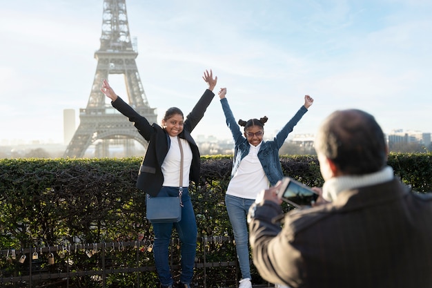 Family taking a picture in their travel to paris