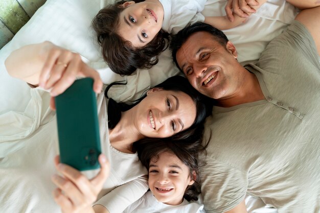 Family taking a selfie with a smartphone