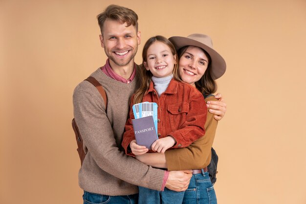 family of three ready for traveling with passport and plane tickets
