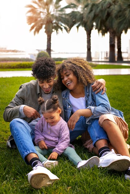 Family of three spending time together outdoors on father's day