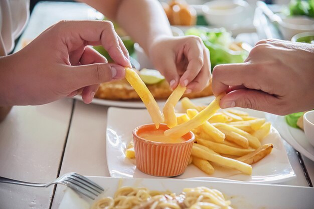 Family time eat French fries together 