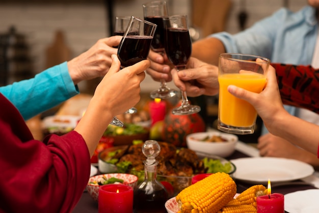 Family toasting glasses on thanksgiving event