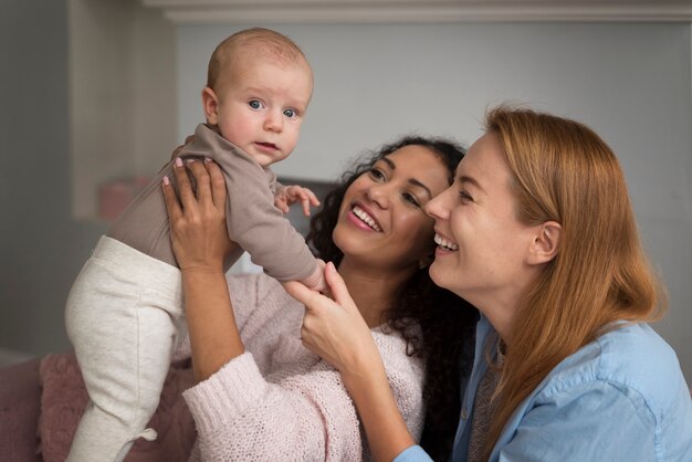 Family of two mums having a baby