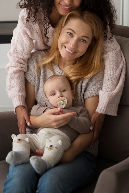 Free photo family of two mums having a baby