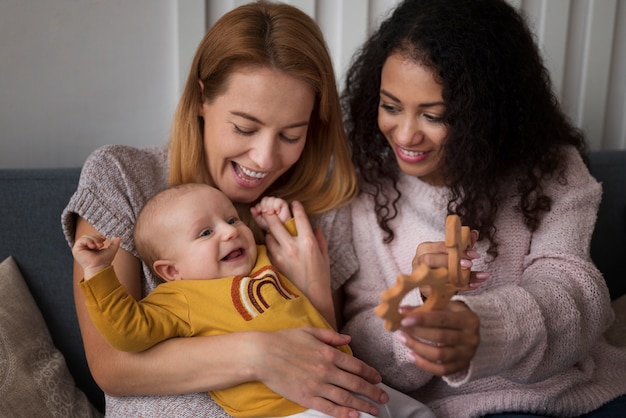 Family of two mums having a baby