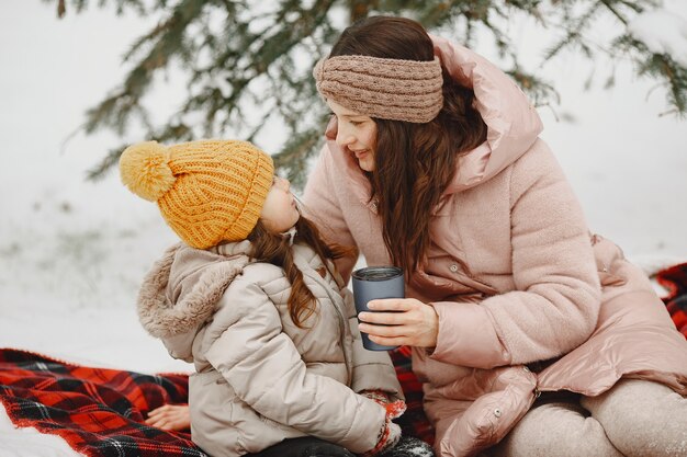 Family on vacation in snowy forest