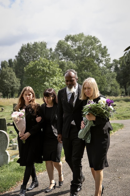 family visiting grave of loved one