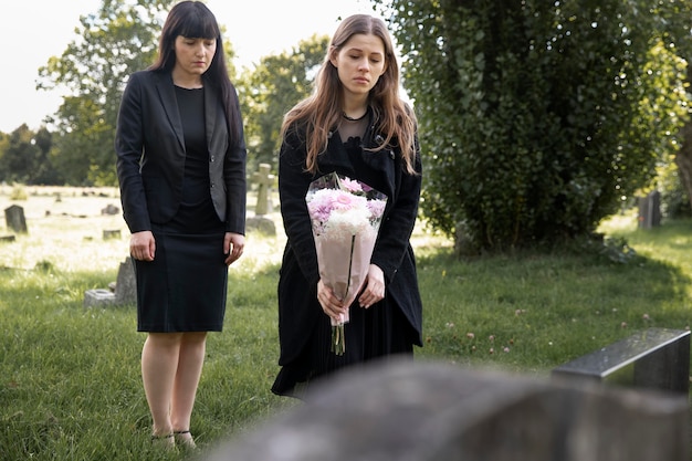 Family visiting grave of loved one