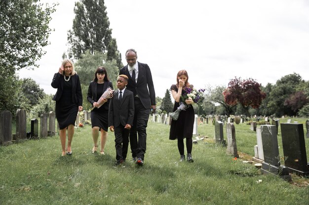 Family visiting grave of loved one