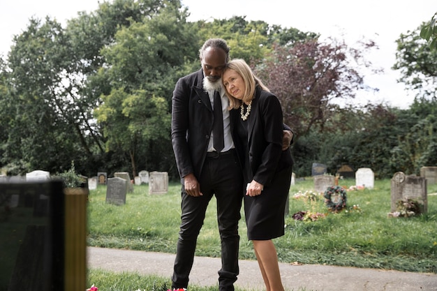 Family visiting grave of loved one