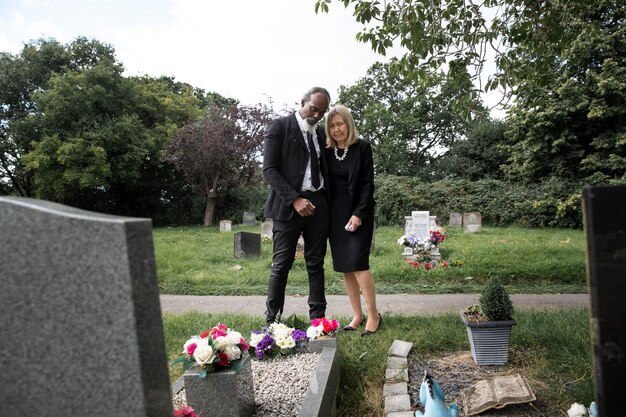 Family visiting grave of loved one