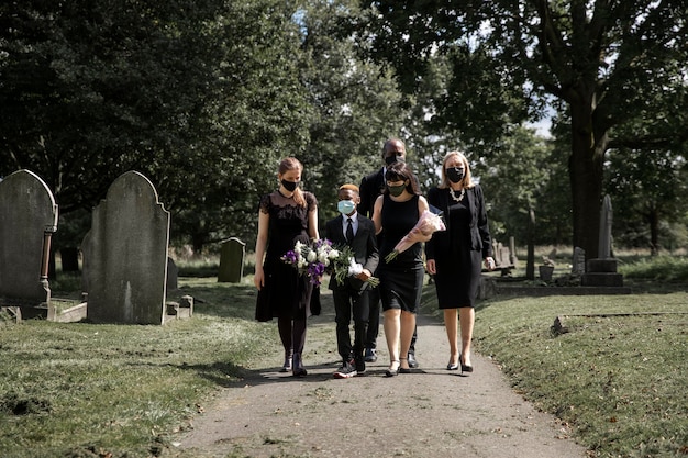 Family visiting grave of loved one