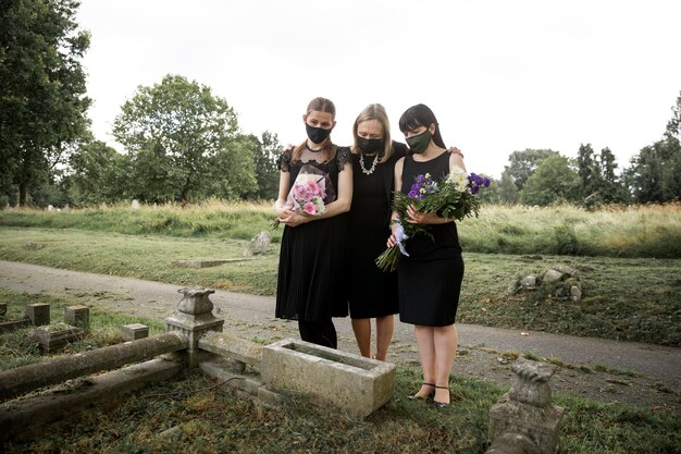 Family visiting grave of loved one