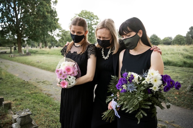 Family visiting grave of loved one