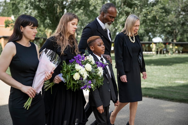 Family visiting grave of loved one