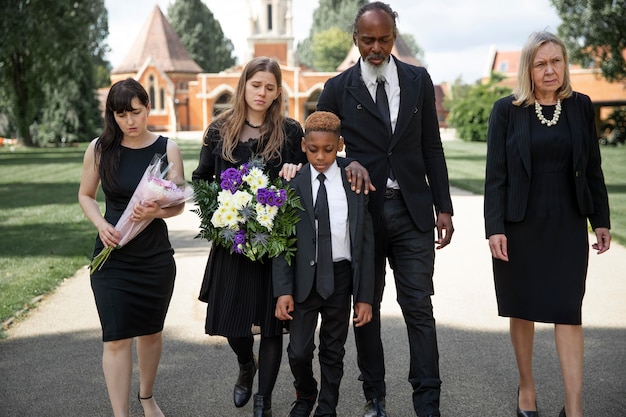 Family visiting grave of loved one