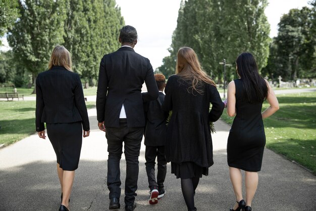 Family visiting grave of loved one