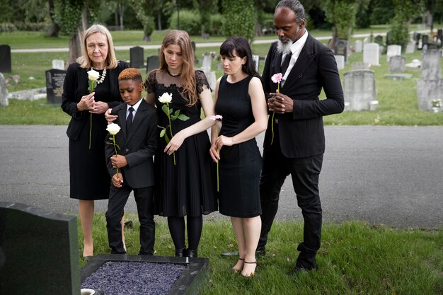 Family visiting grave of loved one