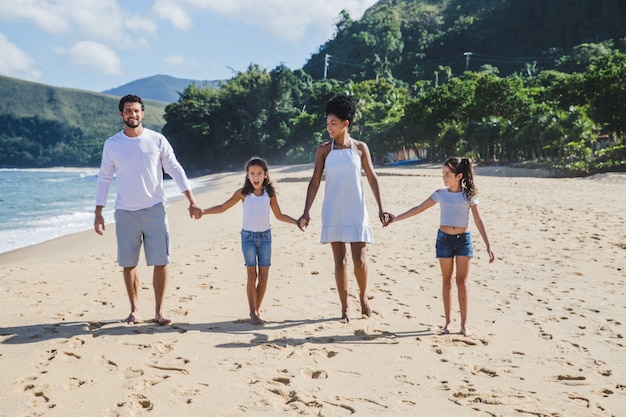 Family walk on the beach