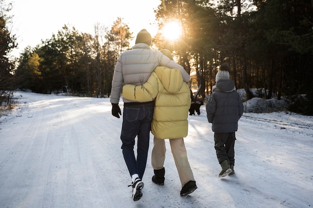 Free photo family walking together in nature