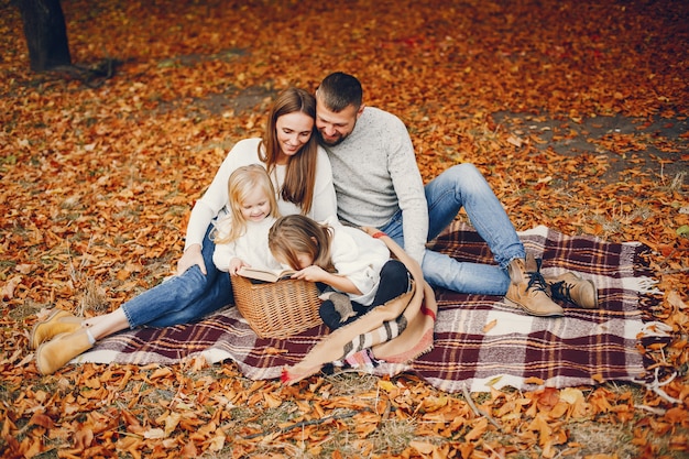 Family with cute kids in a autumn park