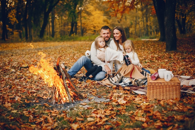 Family with cute kids in a autumn park