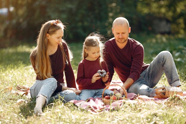 Family with cute kids in a autumn park