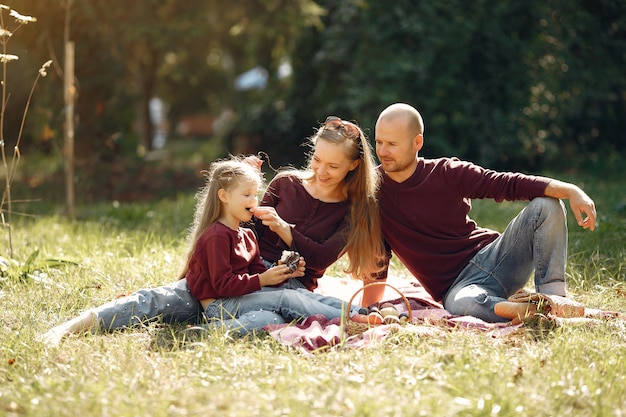 Free photo family with cute kids in a autumn park