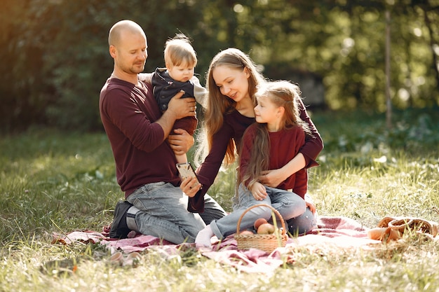 Family with cute kids in a autumn park