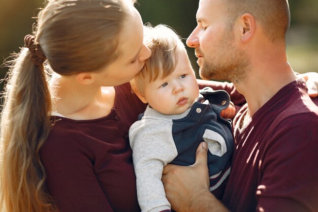 Family with cute kids in a autumn park