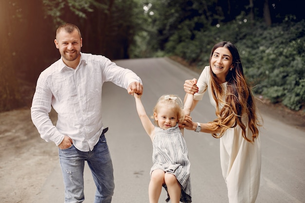 Family with daughter playing in a park