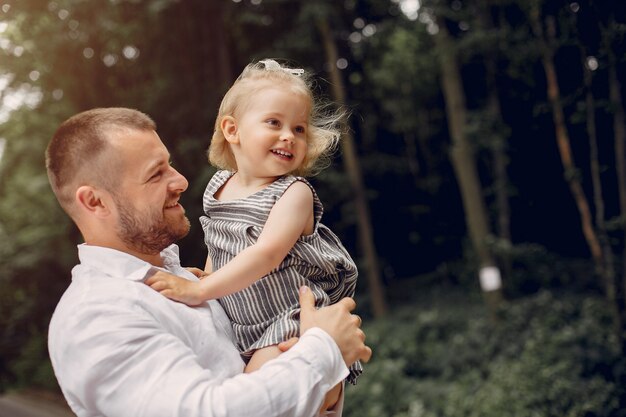 Family with daughter playing in a park