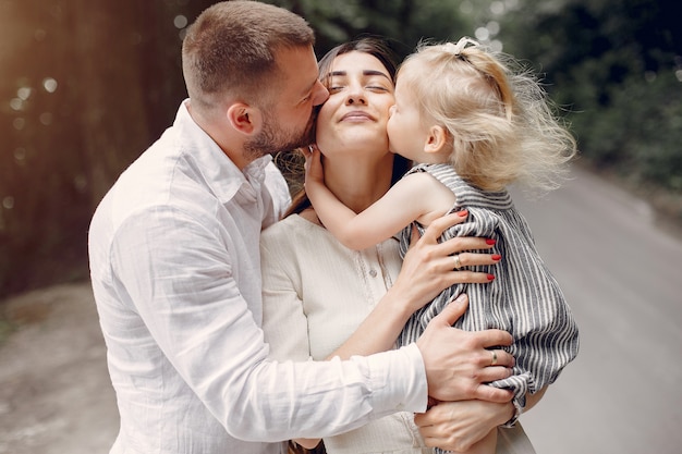 Family with daughter playing in a park