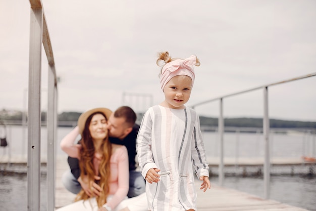 Family with daughter playing in a park