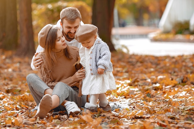 Family with little daughter in a autumn park