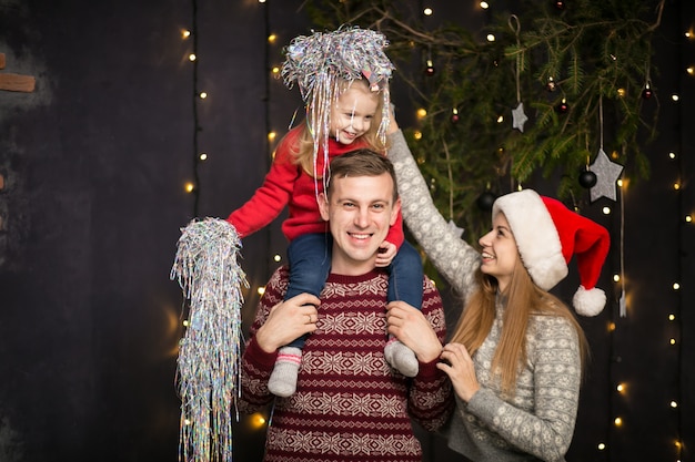 Family with little daughter celebrating New Year