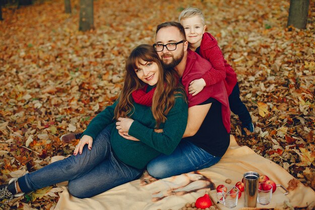 Family with little son in a autumn park