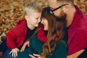 Free photo family with little son in a autumn park