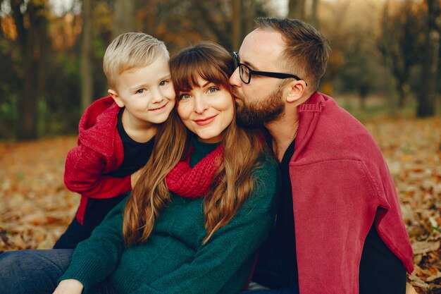 Family with little son in a autumn park